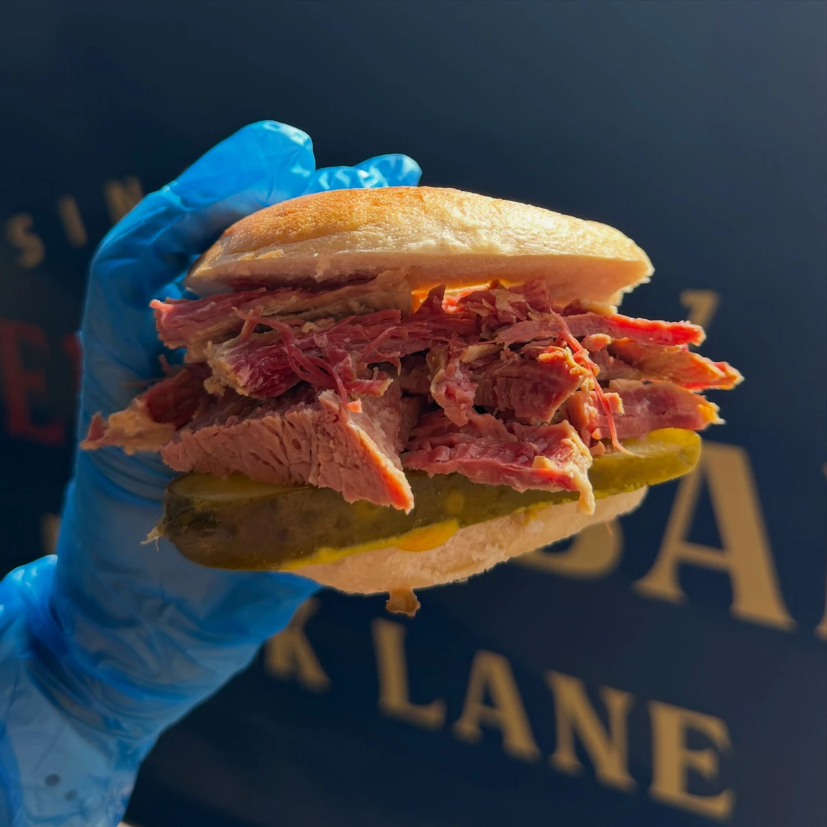 Salt beef beigel with mustard and pickles, photographed by Beigel Bar Brick Lane